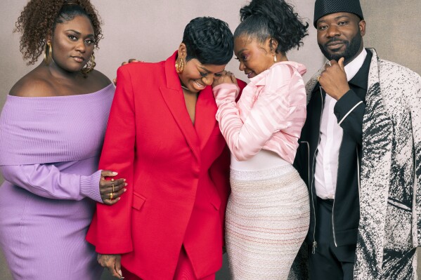 Danielle Brooks, from left, Fantasia Barrino, Taraji P. Henson and Blitz Bazawule pose for a portrait to promote the film "The Color Purple" on Thursday, Dec. 7, 2023, in Los Angeles. (Photo by Willy Sanjuan/Invision/AP)