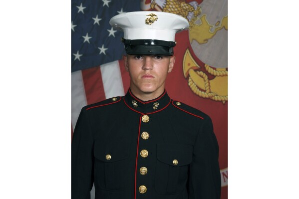 FILE - In this undated photo released by the 1st Marine Division, Camp Pendleton/U.S. Marines is Marine Corps Lance Cpl. Rylee J. McCollum. A lawyer for the family of McCollum, who was killed in Afghanistan, said Thursday, Aug. 24, 2023, he'll soon file a new version of a $25 million lawsuit accusing actor Alec Baldwin of unleashing his social media followers against them. (U.S. Marines via AP, File)