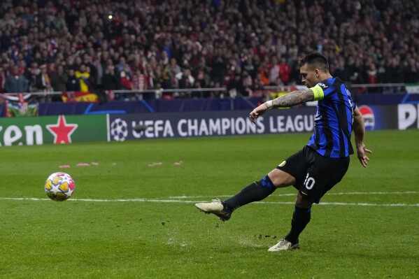 Inter Milan's Lautaro Martinez misses in the penalty shootout during the Champions League, round of 16, second leg soccer match between Atletico Madrid and Inter Milan at the Metropolitano stadium in Madrid, Spain, Wednesday, March 13, 2024. Atletico Madrid won 3-2 in a penalty shootout. (AP Photo/Manu Fernandez)