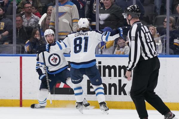 Winnipeg Jets' Pierre-Luc Dubois is congratulated by Kyle Connor (81) after scoring the game-winning goal in overtime of an NHL hockey game against the St. Louis Blues Sunday, March 13, 2022, in St. Louis. (AP Photo/Jeff Roberson)