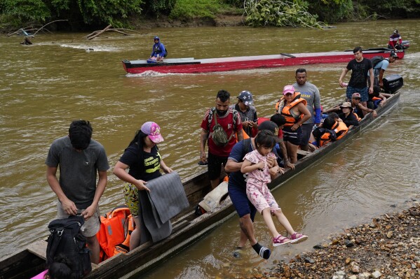 Migrants heading north ride arrive to Lajas Blancas, Darien province, Panama, Friday, Oct. 6, 2023, after walking across the Darien Gap from Colombia. (AP Photo/Arnulfo Franco)