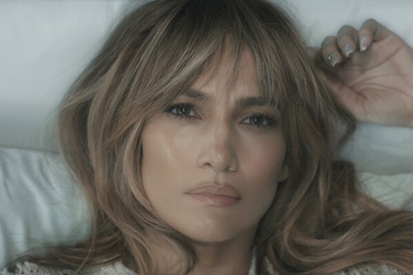 This image released by Prime shows Jennifer Lopez in a scene from "This Is Me...Now: A Love Story." (Prime via AP)
