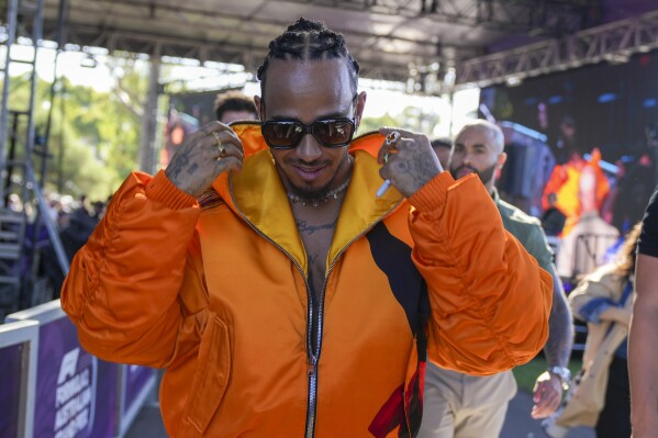 Mercedes driver Lewis Hamilton of Britain arrives at the Albert Park circuit ahead of the Australian Formula One Grand Prix in Melbourne, Australia, Thursday, March 21, 2024. (AP Photo/Asanka Brendon Ratnayake)