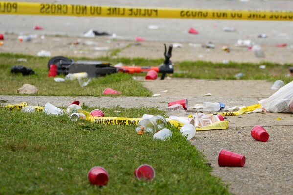 FILE - Party debris is seen in the area of a mass shooting incident in the Southern District of Baltimore, July 2, 2023. Baltimore police announced in a news release Wednesday morning, Sept. 13, that a fifth teenager has been arrested in connection with the mass shooting that unfolded during a Baltimore block party over the July 4 holiday weekend, leaving two dead and 28 others wounded. (AP Photo/Julio Cortez, File)