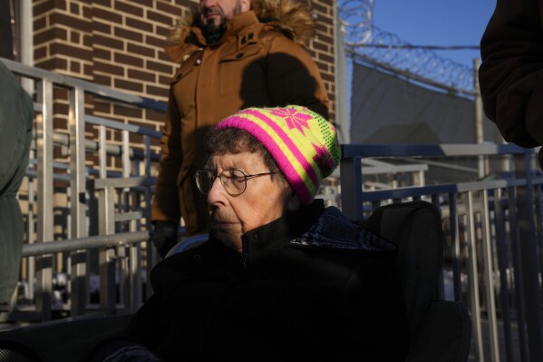 Sister JoAnn Persch, 90, a nun with the Sisters of Mercy, prays with others during a vigil outside a United States Immigration and Customs Enforcement detention facility, Friday, Feb. 21, 2025, in Broadview, Ill. (AP Photo/Erin Hooley)