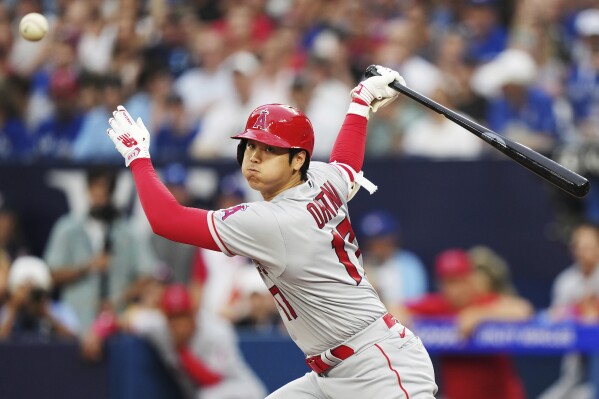 Los Angeles Angels designated hitter Shohei Ohtani watches a foul ball during the third inning of the team's baseball game against the Toronto Blue Jays on Friday, July 28, 2023, in Toronto. (Nathan Denette/The Canadian Press via AP)