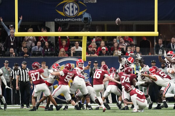Alabama place-kicker Will Reichard (16) kicks a field goal during the second half of the Southeastern Conference championship NCAA college football game against Georgia in Atlanta, Saturday, Dec. 2, 2023. (APPhoto/Mike Stewart)