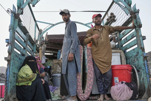 Repatriated Afghan refugees arrive at a camp after crossing the Pakistan-Afghanistan border, in Torkham, Afghanistan, Saturday, May 31, 2025. (AP Photo/Ebrahim Noroozi)