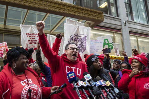 Chicago Teachers Union President Jesse Sharkey speaks during a rally outside Chicago Public Schools headquarters in the Loop, before marching through downtown with thousands of striking union members and their supporters, Thursday, Oct. 17, 2019, in Chicago. Striking teachers went on strike after their union and city officials failed to reach a contract deal in the nation's third-largest school district. (Ashlee Rezin Garcia/Chicago Sun-Times via AP)
