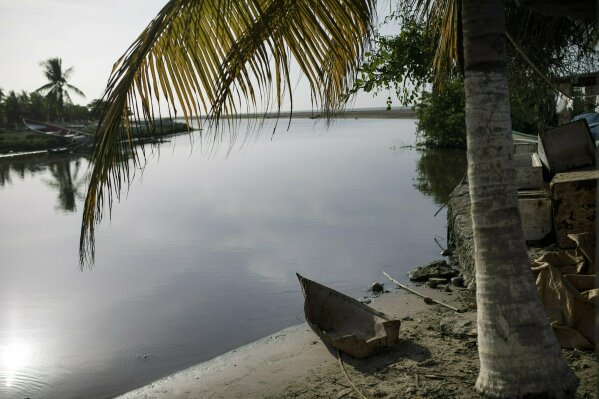 
              A toy boat made of out of sheet metal sits on the banks of the Cupira River in Machurucuto, Venezuela, Sunday, May 5, 2019. Fifty-two years ago this month an expeditionary force of 12 guerrillas departed from the communist-run island and days later landed in this sleepy fishing village with the goal of spreading Fidel Castro's revolution to South America. (AP Photo/Rodrigo Abd)
            