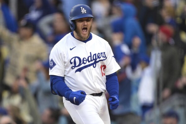 Los Angeles Dodgers Max Muncy celebrates after hitting a two-run home run in the eighth inning of a baseball game against the St. Louis Cardinals, Sunday, March 31, 2024, in Los Angeles. (AP Photo/Jayne-Kamin-Oncea)