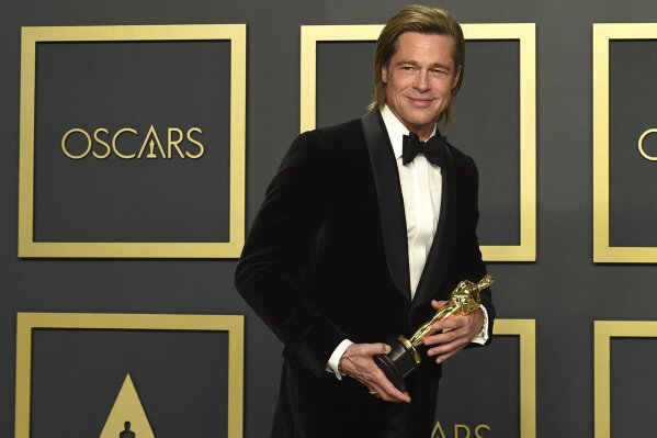 Brad Pitt, winner of the award for best performance by an actor in a supporting role for "Once Upon a Time in Hollywood", poses in the press room at the Oscars on Sunday, Feb. 9, 2020, at the Dolby Theatre in Los Angeles. (Photo by Jordan Strauss/Invision/AP)
