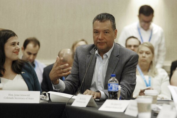 In this Monday, July 1, 2019 photo, California Secretary of State Alex Padilla speaks at a gathering of state election chiefs in Santa Fe, N.M., alongside Colorado Secretary of State Jena Griswold, left. An election security official with the U.S. Department of Homeland Security at the convention warned top state election officials nationwide to safeguard against fraudulent "phishing" emails targeting state and local election workers. Padilla also expressed concern about such emails that appear as if they come from a legitimate source and contain links that, if clicked, can open up election data systems to manipulation or attacks. (AP Photo/Morgan Lee)