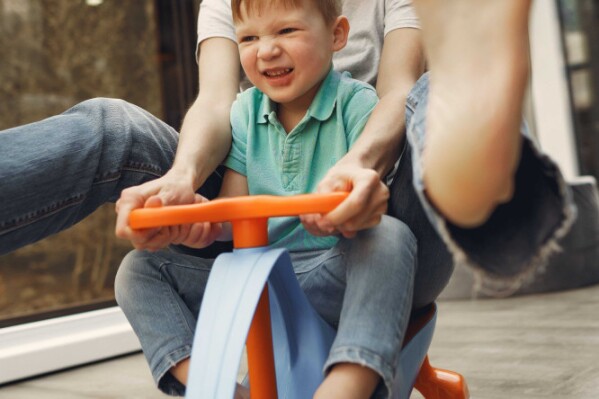 Joyful mother and son playing