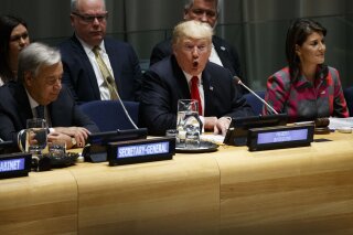 
              United Nations Secretary General Antonio Guterres, left, and U.S. Ambassador to the United Nations Nikki Haley, right, listen as President Donald Trump speaks during the "Global Call to Action on the World Drug Problem" at the United Nations General Assembly, Monday, Sept. 24, 2018, at U.N. Headquarters. (AP Photo/Evan Vucci)
            