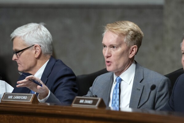 Sen. James Lankford, R-Okla., questions Robert F. Kennedy Jr., President Donald Trump's choice to be the Secretary of Health and Human Services,  as he testifies before the Senate Finance Committee during his confirmation hearing, at the Capitol in Washington, Wednesday, Jan. 29, 2025. (AP Photo/Jose Luis Magana)