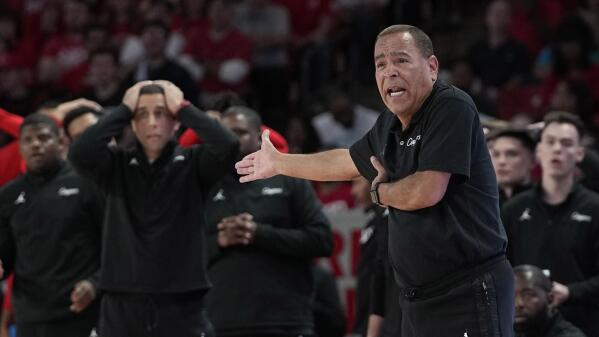 FILE - Houston coach Kelvin reacts to a foul call during the second half of an NCAA college basketball game against Central Florida Saturday, Dec. 31, 2022, in Houston. The way Houston’s coach sees it, the people running programs had better evolve quickly to manage demands that are only becoming more far-reaching by the day – even amid the heat of the NCAA Tournament pushing into its second weekend. (AP Photo/David J. Phillip, File)