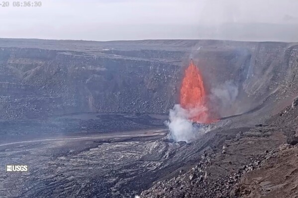This image from webcam footage provided by the United States Geological Survey (USGS) shows lava fountains shooting up high in the latest episode of an ongoing eruption of Kilauea volcano inside Hawaii Volcanoes National Park on Thursday, March 20, 2025. (United States Geological Survey via AP)