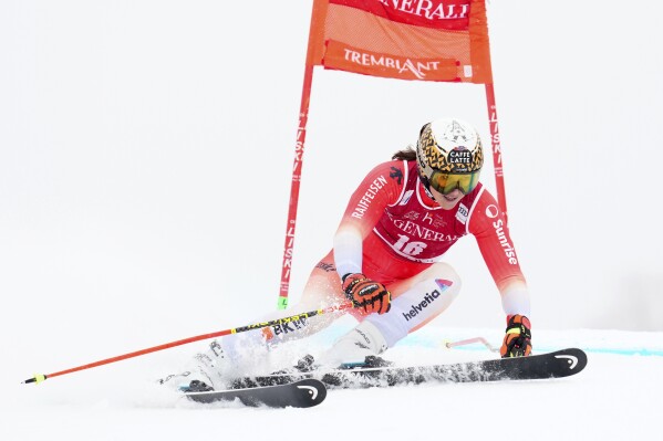 Wendy Holdener of Switzerland speeds down the course during the women's World Cup giant slalom in Mont Tremblant, Que., Saturday, Dec. 2, 2023. (Sean Kilpatrick/The Canadian Press via AP)