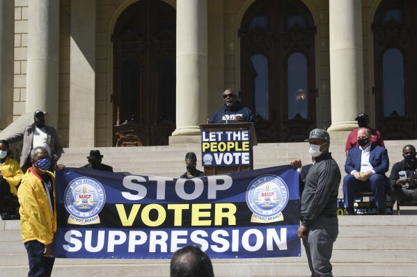 Reverend Kenneth Pierce, 1st VP of the Detroit Branch NAACP, and pastor at Hopewell Missionary Baptist Church, speaks Tuesday, April 13, 2021, during a rally to support voting rights & end voter suppression at the Capitol in Lansing, Mich. The event was sponsored by the Detroit branch of the NAACP.  (Matthew Dae Smith /Lansing State Journal via AP)