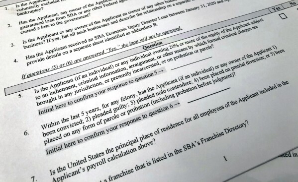 FILE - A portion of a Small Business Administration Paycheck Protection Program Borrower Application Form is seen in Washington on Tuesday, April 21, 2020. An Associated Press analysis published on Monday, June 12, 2023, found that fraudsters potentially stole more than $280 billion in COVID-19 relief funding; another $123 billion was wasted or misspent. Combined, the loss represents a jarring 10 percent of the total $4.2 trillion the U.S. government has so far disbursed in COVID-relief aid. (AP Photo/Wayne Partlow, File)