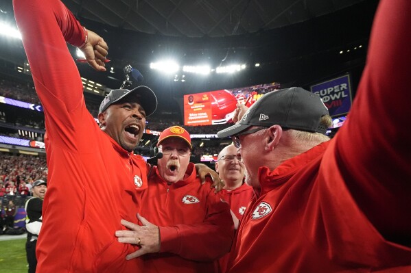 Kansas City Chiefs head coach Andy Reid, center, celebrates with his coaches after the NFL Super Bowl 58 football game against the San Francisco 49ers, Sunday, Feb. 11, 2024, in Las Vegas. The Chiefs won 25-22 against the 49ers. (AP Photo/Julio Cortez)