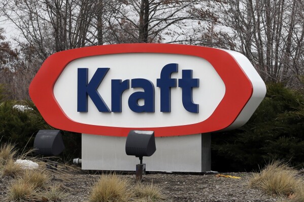 FILE - This March 25, 2015, file photo shows the Kraft logo in Northfield, Ill. The Biden administration announced $6 billion in funding Monday, March 25, 2024, for projects that will slash emissions from the industrial sector — the largest-ever U.S. investment to decarbonize domestic industry to fight climate change. Kraft Heinz will install heat pumps, electric heaters and electric boilers to decarbonize food production at numerous facilities. (AP Photo/Nam Y. Huh, File)