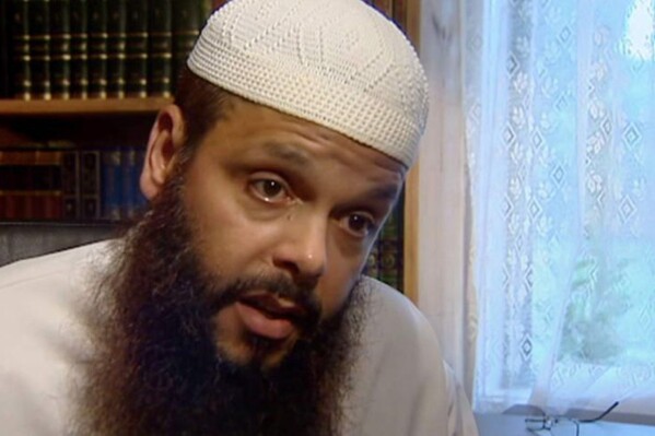 FILE - In this image made from a 2005 video, Abdul Benbrika, an Algerian-born Muslim cleric, speaks during an interview at his home in Melbourne, Australia. Benbrika, a convicted terrorist whom Australia had wanted to strip of citizenship and deport is to be released into the community under strict conditions Tuesday, Dec. 19, 2023. (Australian Broadcasting Corporation via AP, File)
