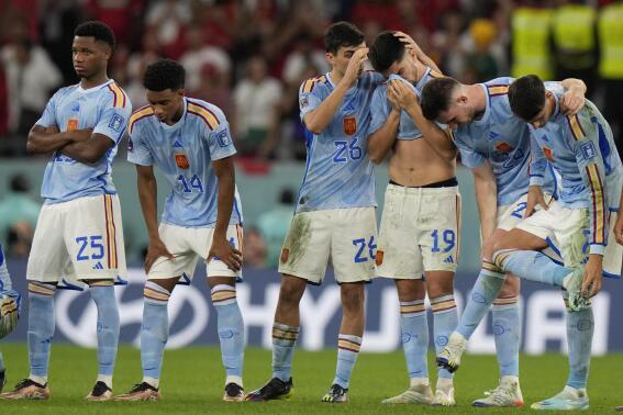 Spain's players react after the penalty shootout at the World Cup round of 16 soccer match between Morocco and Spain, at the Education City Stadium in Al Rayyan, Qatar, Tuesday, Dec. 6, 2022. (AP Photo/Luca Bruno)
