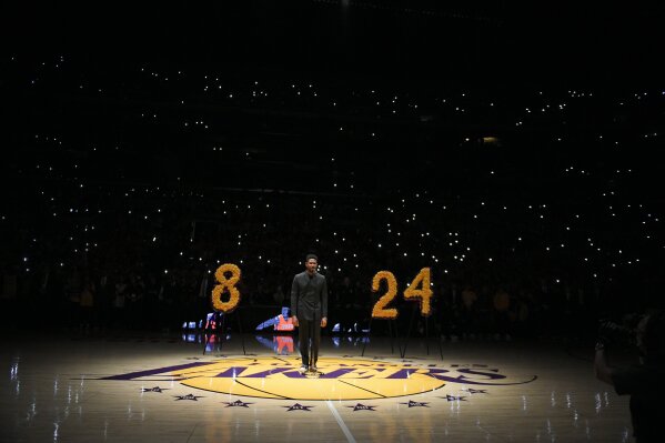 Singer Usher performs during a memorial for Kobe Bryant, prior to an NBA basketball game between the Los Angeles Lakers and the Portland Trail Blazers in Los Angeles, Friday, Jan. 31, 2020. (AP Photo/Kelvin Kuo)