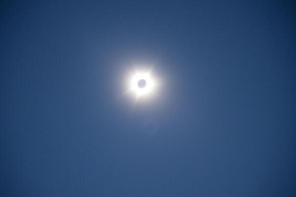 The sun and moon are photographed near Exmouth, Australia, during a solar eclipse on Thursday, April 20, 2023. The lucky few in the path of the hybrid solar eclipse will either get plunged into the darkness of a total eclipse or they'll see a "ring of fire" as the sun peeks out from behind the moon. (Aaron Bunch/AAP Image via AP)