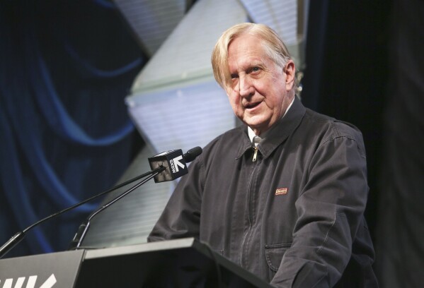 FILE - T Bone Burnett gives a keynote during the South by Southwest Music Festival at the Austin Convention Center on Wednesday, March 13, 2019, in Austin, Texas. Burnett, most celebrated for his production acumen, uprooted from Los Angeles to move to Nashville and recorded a warm-hearted disc of his own songs for the first time in nearly two decades. Indie rockers Lucius and Rosanne Cash add their voices to the acoustic collection. (Photo by Jack Plunkett/Invision/AP, File)