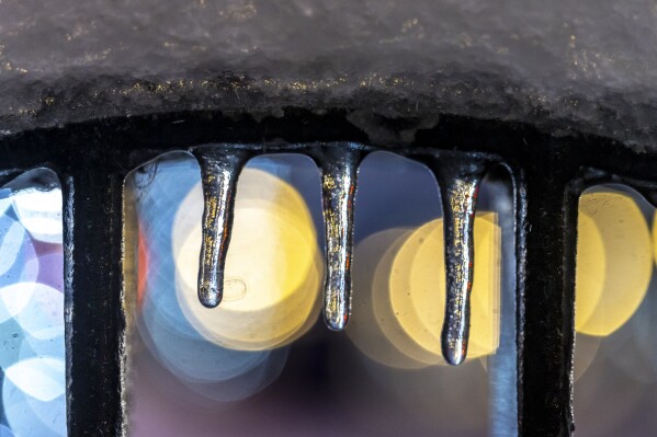Ice hangs from a bike rack in downtown Lexington, Ky., on Monday, Jan. 6, 2025. (Ryan C. Hermens/Lexington He rald-Leader via AP)