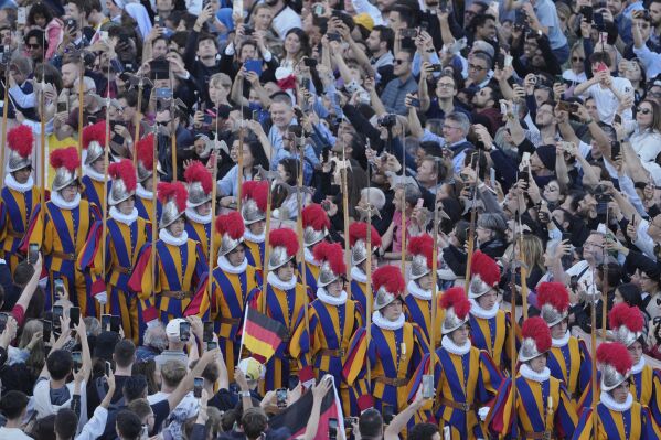 Swiss Guards march after a new Pope was elected when 133 cardinals gathered on the second day of the conclave to select a successor to the late Pope Francis, at the Vatican, Thursday, May 8, 2025. (AP Photo/Markus Schreiber)