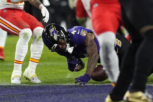 Baltimore Ravens wide receiver Zay Flowers (4) fumbles into the end zone during the second half of the AFC Championship NFL football game against the Kansas City Chiefs, Sunday, Jan. 28, 2024, in Baltimore. (AP Photo/Matt Slocum)