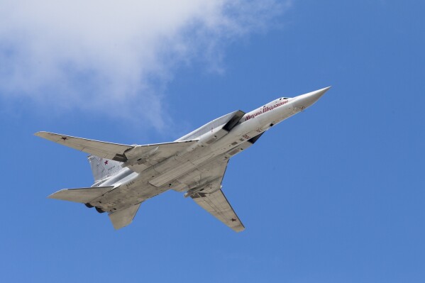 A TU-22M bomber plane flies over Red Square during a rehearsal for the Victory Day military parade in Moscow, Russia, May 7, 2016. (AP Photo/Alexander Zemlianichenko, File)