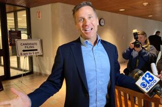 Former Missouri Gov. Eric Greitens gestures while speaking to reporters in Jefferson City on Tuesday, Feb. 22, 2022, after he filed to run in the Republican primary for U.S. Senate. Greitens resigned in 2018 a year-and-a-half into his first term as governor, but is staging a political comeback as he seeks the seat being vacated by the retirement of incumbent Republican Sen. Roy Blunt. (AP Photo/David A. Lieb)