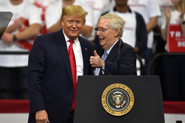 FILE - Then President Donald Trump, left, and Senate Majority Leader Mitch McConnell of Ky., greet each other during a campaign rally in Lexington, Ky., Nov. 4, 2019. McConnell has endorsed Donald Trump for president. (AP Photo/Timothy D. Easley, File)