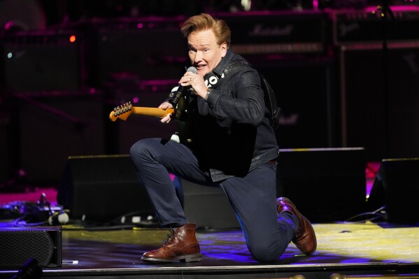 Conan O'Brien performs at the 8th annual Love Rocks NYC concert benefiting God's Love We Deliver at the Beacon Theatre, Thursday, March 7, 2024, in New York. (Photo by Charles Sykes/Invision/AP)