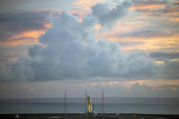 The NASA moon rocket stands ready at sunrise on Pad 39B before the Artemis 1 mission to orbit the moon at the Kennedy Space Center, Monday, Aug. 29, 2022, in Cape Canaveral, Fla. (Joel Kowsky/NASA via AP)