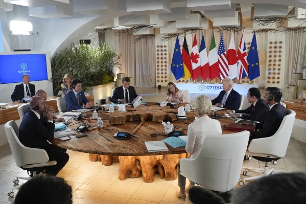 From left, European Council President Charles Michel, German Chancellor Olaf Scholz, Canada's Prime Minister Justin Trudeau, French President Emmanuel Macron, Italian Prime Minister Giorgia Meloni, U.S. President Joe Biden, Japan's Prime Minister Fumio Kishida, Britain's Prime Minister Rishi Sunak and European Commission President Ursula von der Leyen participate in a working session at the G7, Thursday, June 13, 2024, in Borgo Egnazia, Italy. (AP Photo/Alex Brandon, Pool)