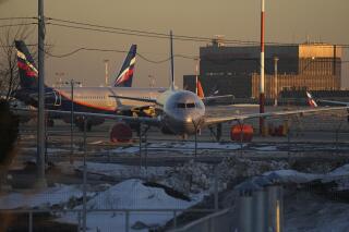 FILE - Aeroflot's passengers planes are parked at Sheremetyevo airport, outside Moscow, Russia, Tuesday, March 1, 2022. China has barred Russia’s airlines from flying foreign-owned jetliners into its airspace, the Russian news outlet RBK reported, after President Vladimir Putin threw ownership of the planes into doubt by allowing them to be re-registered in Russia to avoid seizure under sanctions over Moscow’s attack on Ukraine. (AP Photo/Pavel Golovkin, File)