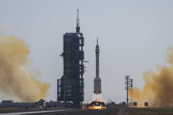 A Long March rocket carrying a crew of Chinese astronauts in a Shenzhou-17 spaceship lifts off at the Jiuquan Satellite Launch Center in northwestern China, Thursday, Oct. 26, 2023. (AP Photo/Andy Wong)