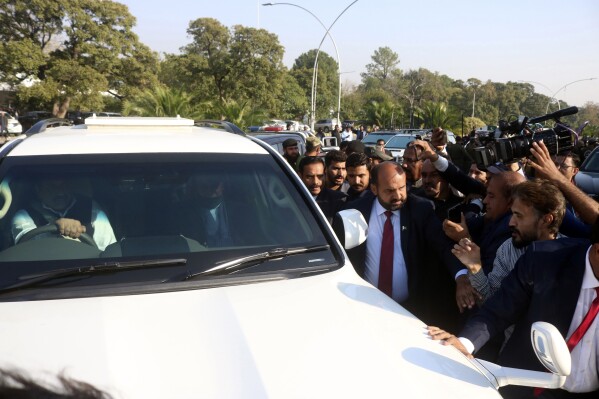 A vehicle carrying former Pakistan's Prime Minister Nawaz Sharif arrives to appear at Islamabad High court in Islamabad, Pakistan, Tuesday, Nov. 21, 2023. A court in Islamabad briefly heard an appeal from former Prime Minister Imran Khan's main political rival, Nawaz Sharif, against his 2018 conviction in a graft case. Sharif, who served as prime minister three times, returned to Pakistan in October, ending four years of self-imposed exile in London mainly to lead his Pakistan Muslim League party in the parliamentary elections. (AP Photo/W.K. Yousafzai)