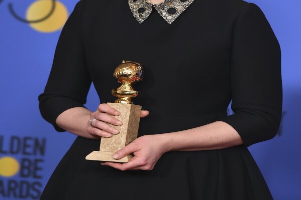 
              Elisabeth Moss poses in the press room with the award for best performance by an actress in a television series - drama for "The Handmaid's Tale" at the 75th annual Golden Globe Awards at the Beverly Hilton Hotel on Sunday, Jan. 7, 2018, in Beverly Hills, Calif. (Photo by Jordan Strauss/Invision/AP)
            