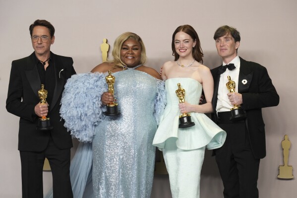 Robert Downey Jr., winner of the award for best performance by an actor in a supporting role for "Oppenheimer," from left, Da'Vine Joy Randolph, winner of the award for best performance by an actress in a supporting role for "The Holdovers," Emma Stone, winner of the award for best performance by an actress in a leading role for "Poor Things," and Cillian Murphy, winner of the award for best performance by an actor in a leading role for "Oppenheimer," pose in the press room at the Oscars on Sunday, March 10, 2024, at the Dolby Theatre in Los Angeles. (Photo by Jordan Strauss/Invision/AP)