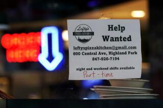 Hiring sign is displayed at a restaurant in Highland Park, Ill., Thursday, July 14, 2022.   The number of Americans applying for unemployment benefits last week rose to its highest level in more than eight months, a sign the labor market may be showing some weakness. Applications for jobless aid for the week ending July 16 rose by 7,000 to 251,000, up from the previous week’s 244,000, the Labor Department reported Thursday, July 21.  (AP Photo/Nam Y. Huh)