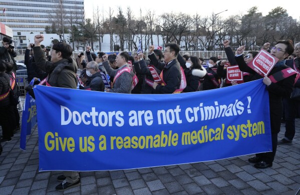 FILE - Doctors stage a rally against the government's medical policy near the presidential office in Seoul, South Korea, on Feb. 25, 2024. (AP Photo/Ahn Young-joon, File)