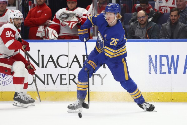 Buffalo Sabres defenseman Rasmus Dahlin (26) passes the puck during the second period of an NHL hockey game against the Detroit Red Wings Tuesday, Dec. 5, 2023, in Buffalo, N.Y. (APPhoto/Jeffrey T. Barnes)