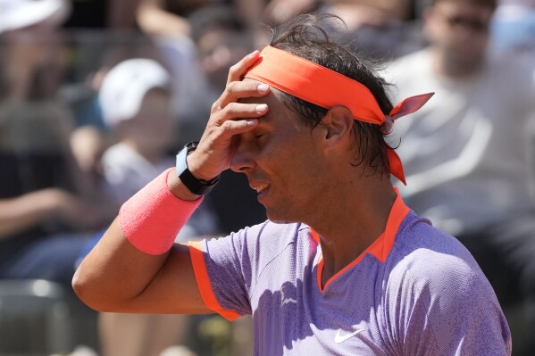 Rafael Nadal, of Spain, leaves after loosing his match against Hubert Hurkacz, of Poland, at the Italian Open tennis tournament in Rome, Saturday, May 11, 2024.(AP Photo/Gregorio Borgia)